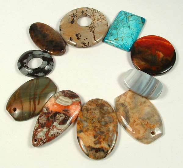 10 Jasper and Agate drilled stones to be used as pendants.