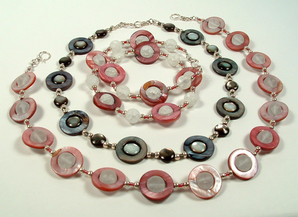 Three shell necklaces nested together.