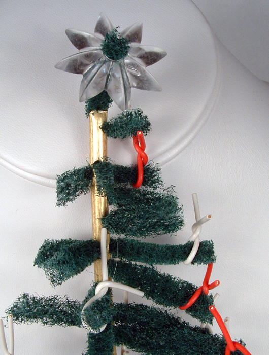 Close-up photo of the star at the top of the tree.