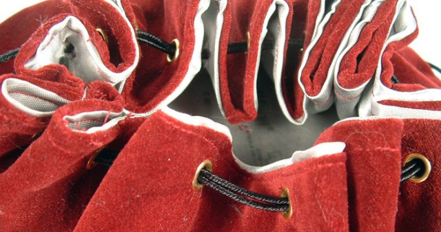 Close-up photo of eyelets on drawstring purse.