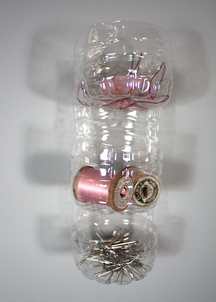 Three-tier plastic bottle organizer