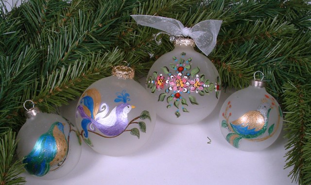 Photo of painted bird ornaments.