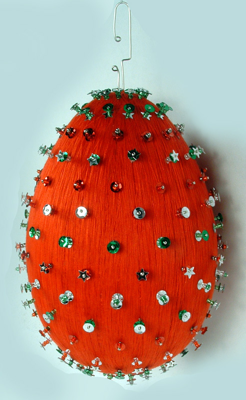 Stryofoam egg decorated with pins, beads and sequins.