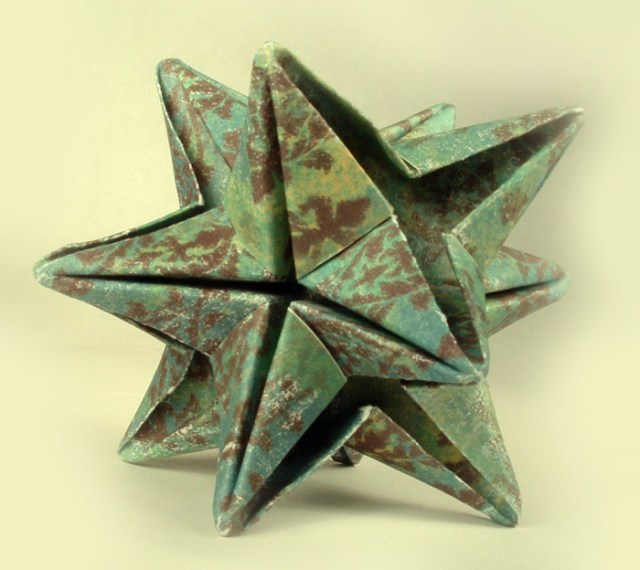 Origami 12 point star made from scrapbook paper.