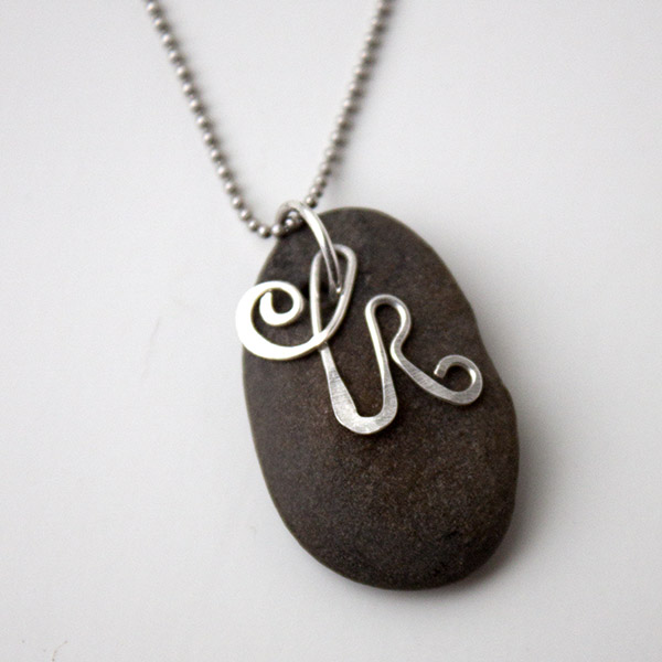 Rock pendant necklace and initial.