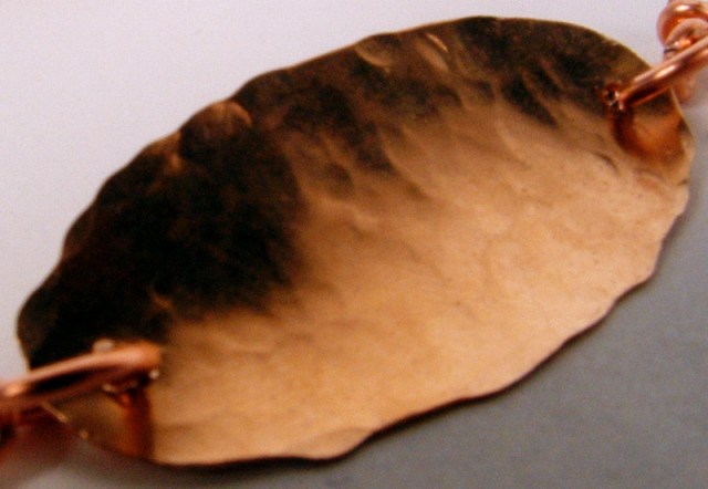 Close-up of the hammered copper leaf.