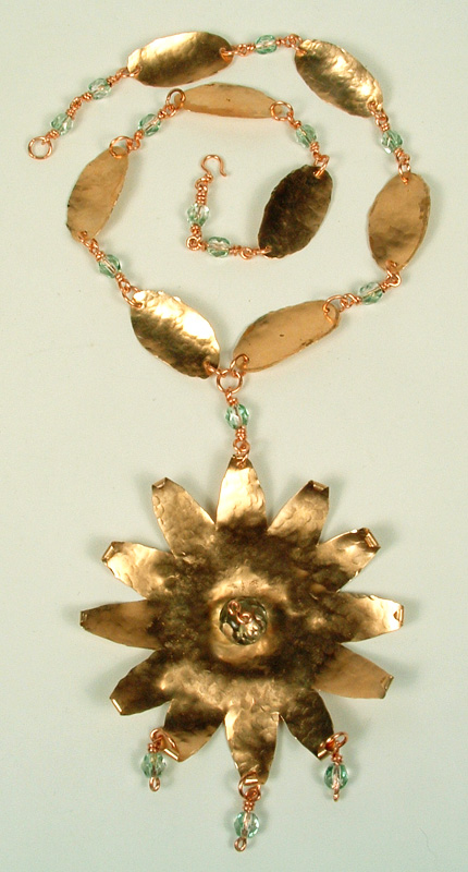 Copper star-burst pendant and leaf chain.