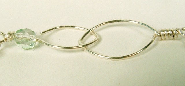 Almond shaped sterling silver clasp.