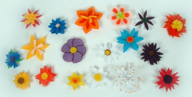 Overhead view of all 18 felt flower magnets.