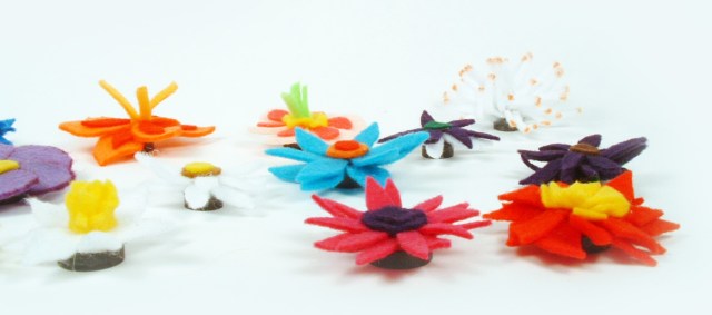 Side view of felt flower magnets.
