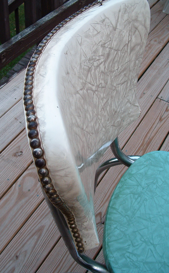 Original chair back with cruddy and old furniture tacks.