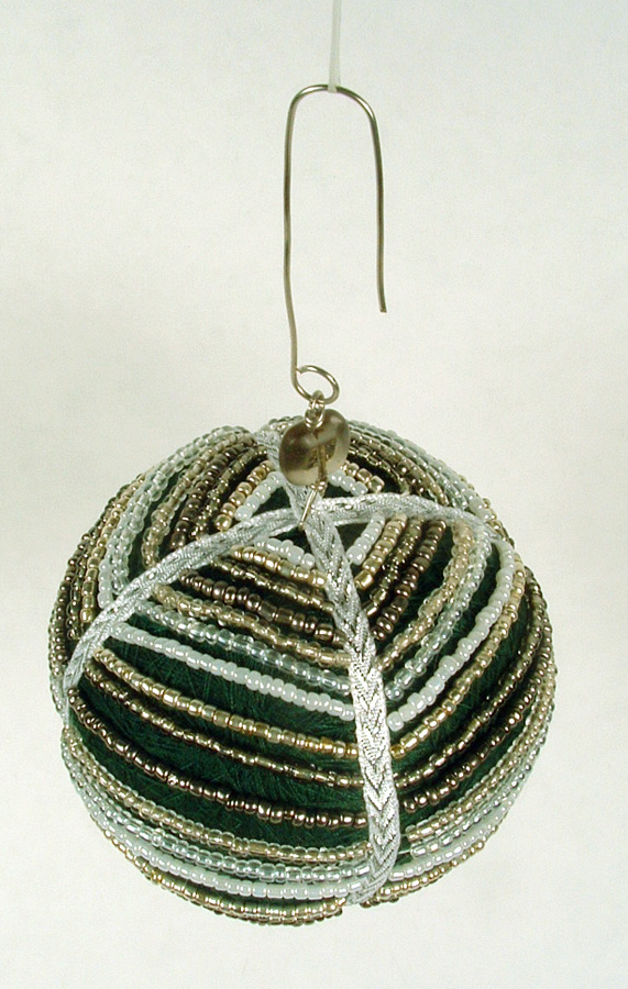 Thread ball draped with seed beads
