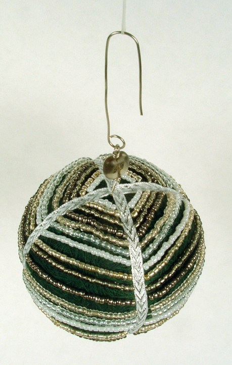 Thread ball draped with seed beads