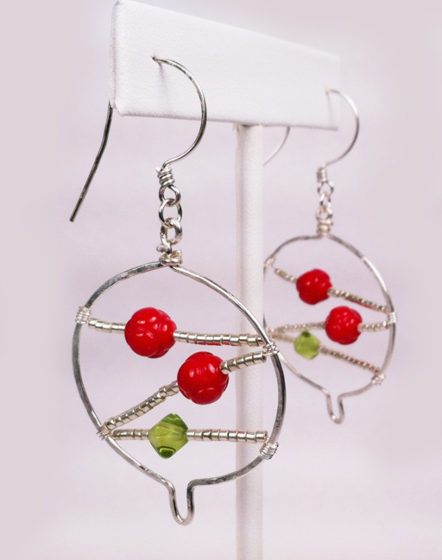 Close up of Christmas ball earrings.