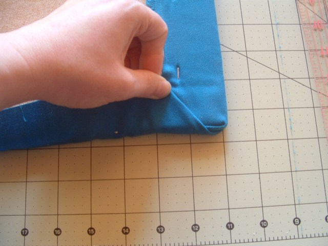 Second step in folding corners.