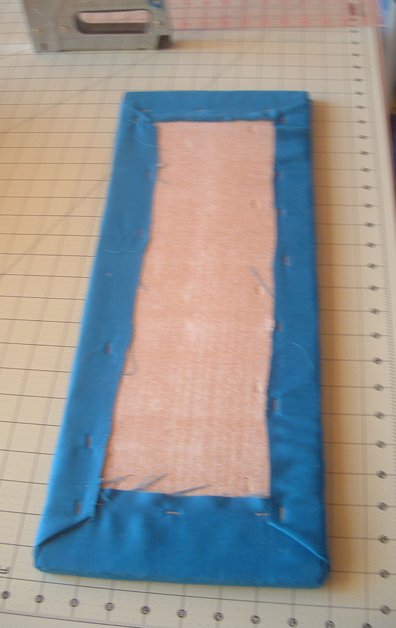 all sides and corners are now stapled to board