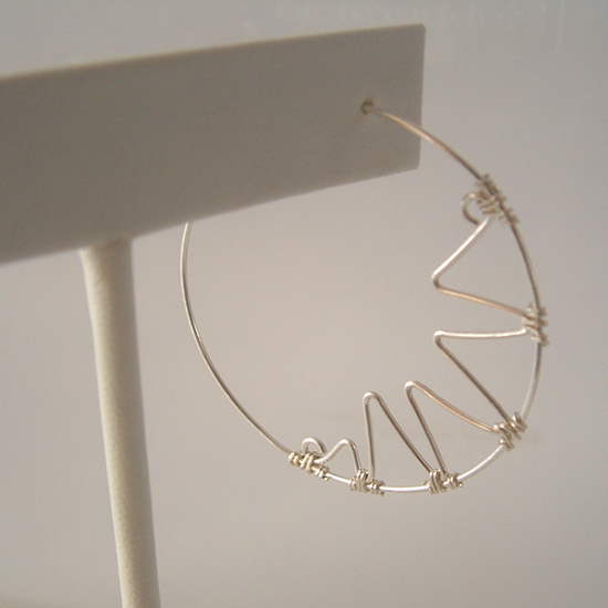 close up of the sterling silver zigzag hoop earrings