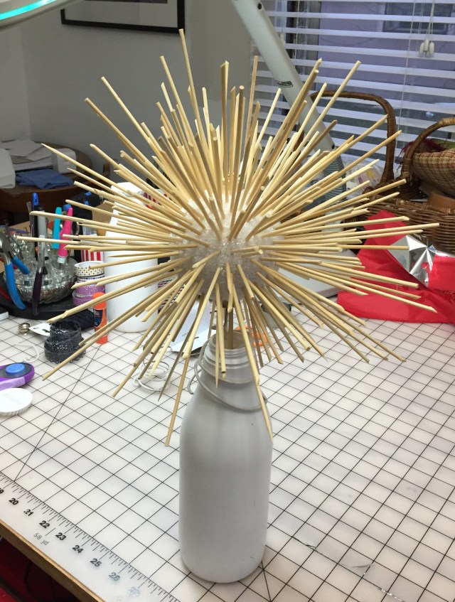 Styrofoam ball with lots and lots of bamboo skewers stuck through it.