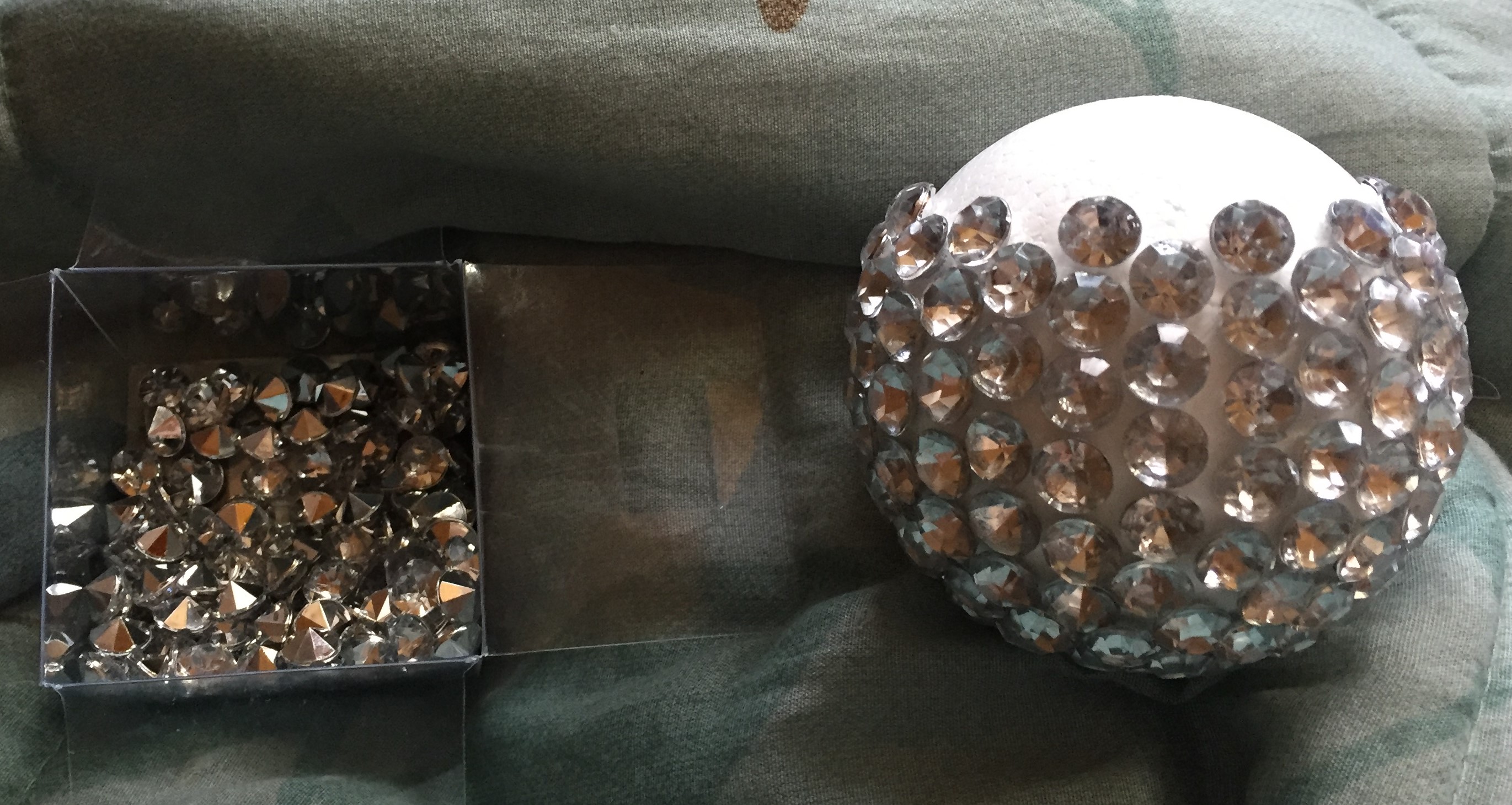 almost done gluing rhinestones to foam ball